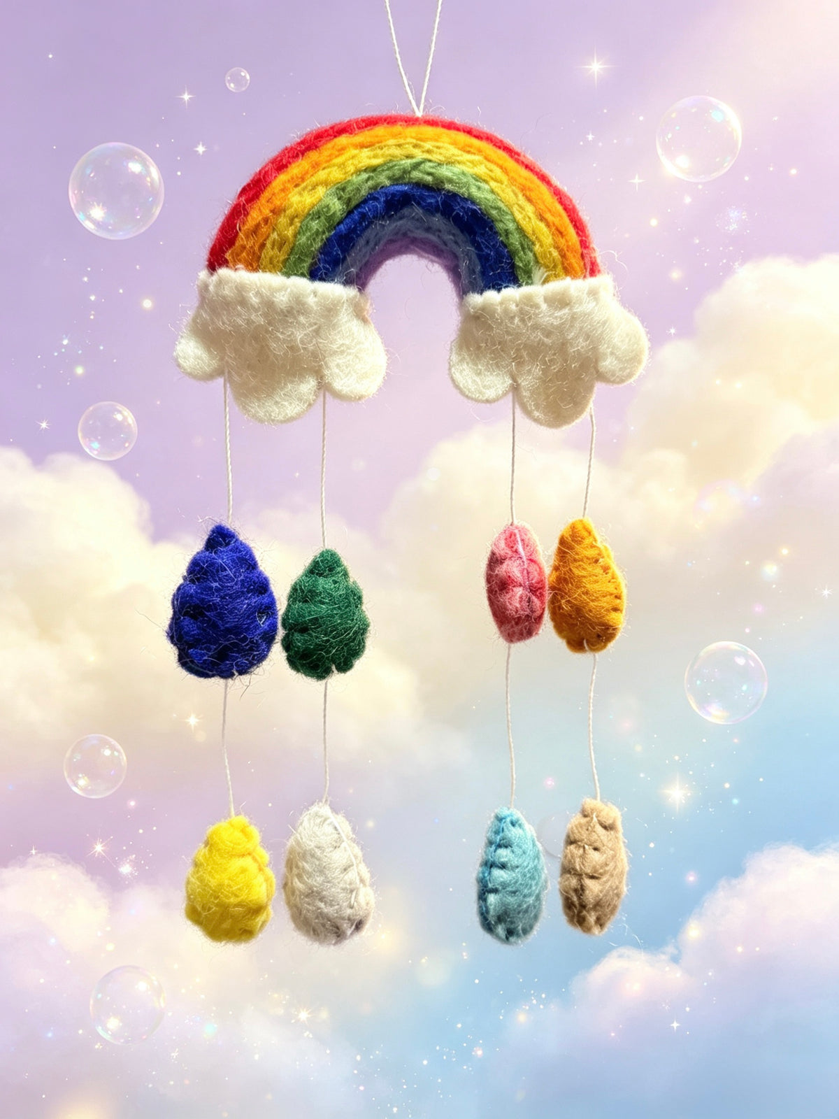 Handmade wool felt rainbow and raindrop hanging decoration in bright cheerful colours