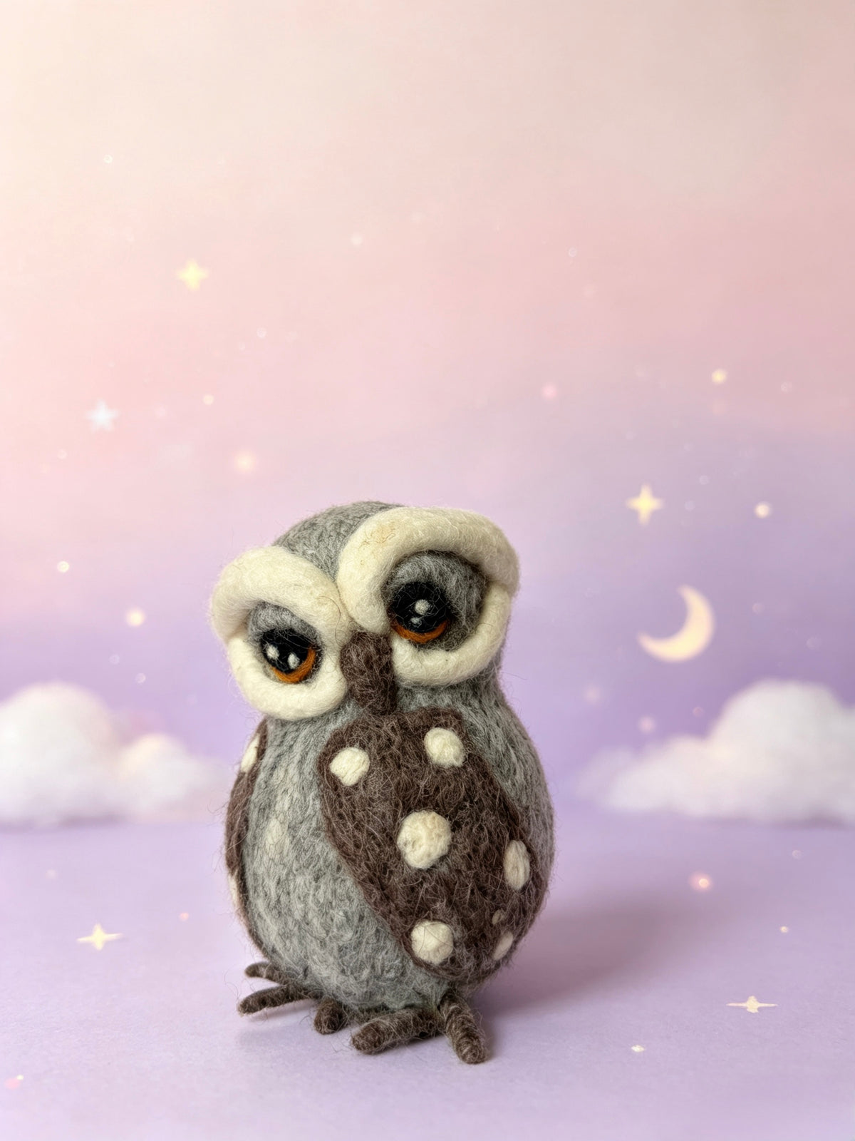 Cute handmade wool felt owl figurine with white facial markings and brown beak