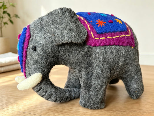 Side view of large handmade wool felt elephant display ornament