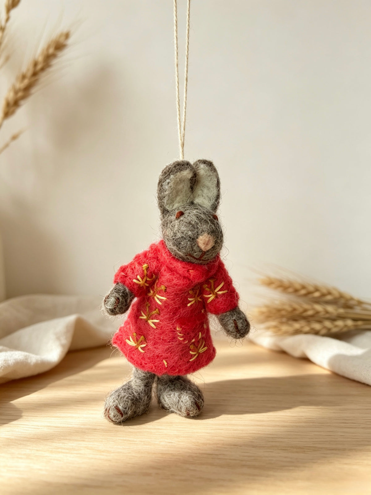 Side view of handmade wool felt bunny rabbit hanging decoration