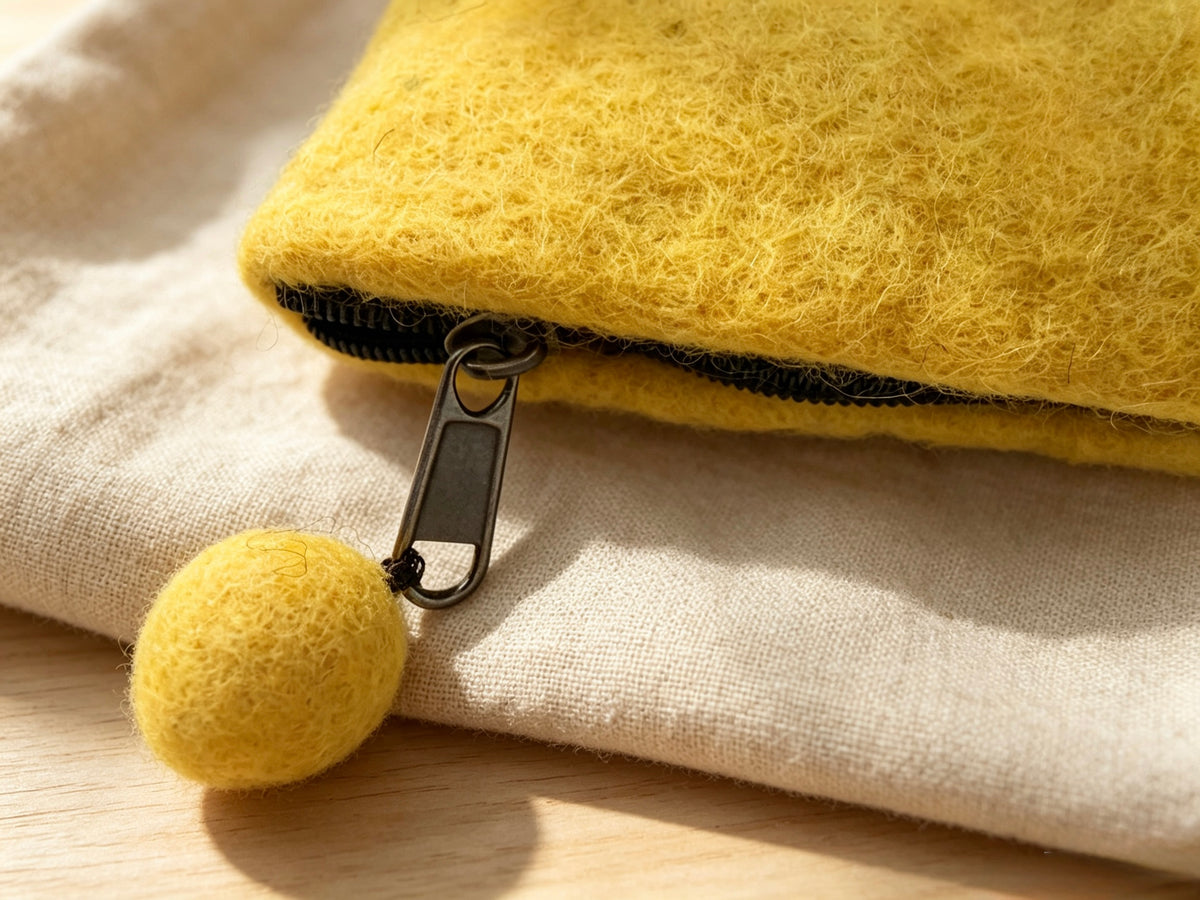 Interior of handmade wool felt hedgehog coin purse with black zip lining