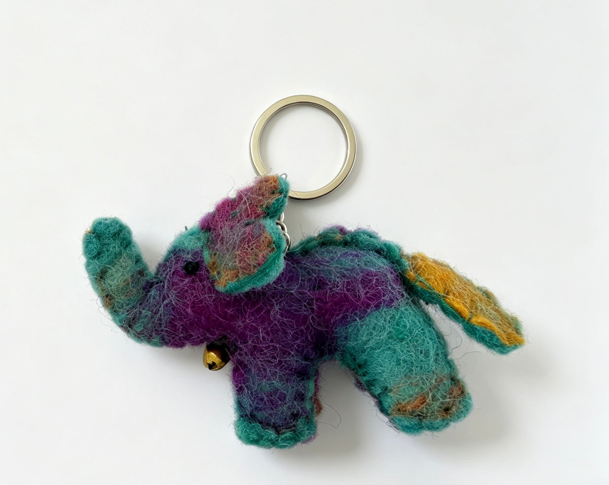 Handmade wool felt elephant keyring shown with its metal ring and colourful body