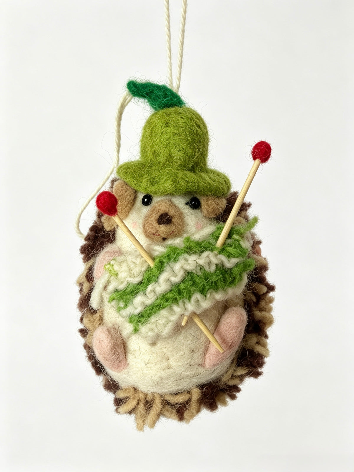 Handmade wool felt hedgehog hanging ornament knitting a green and white scarf